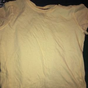 Yellow form fitting shirt